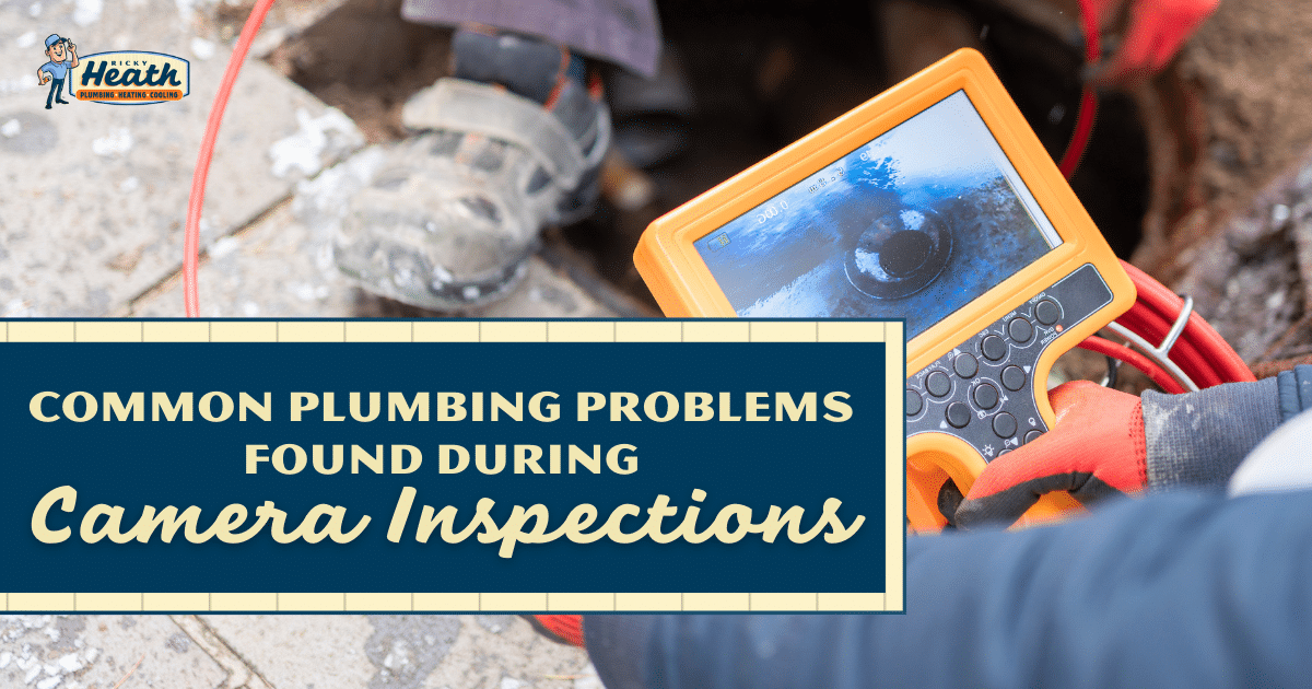 plumber using inspection camera on water heater tank pipe damage