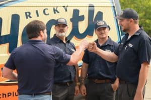 Ricky Heath Technicians Fist Bumping