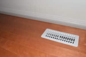 Air,Vent,With,With,White,Cover,On,A,Hardwood,Floor