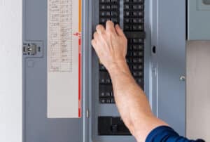Resetting,Tripped,Breaker,In,Residential,Electricity,Power,Panel.