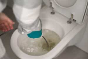 Man,Cleaning,Overflowing,Broken,Toilet.,Clogged,Toilet.